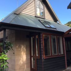 Full exterior cedar and paint restoration on Jacqui's house in Piha