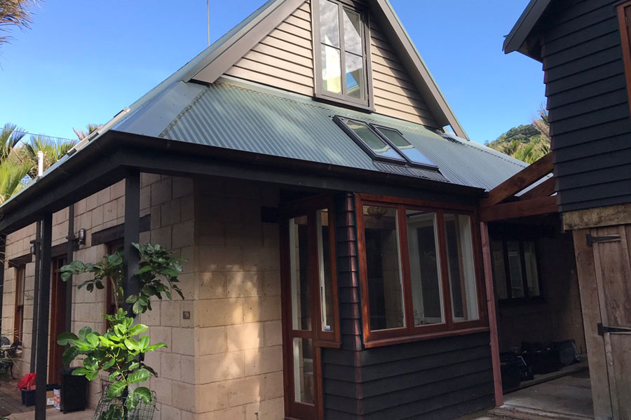 Full exterior cedar and paint restoration on Jacqui's house in Piha